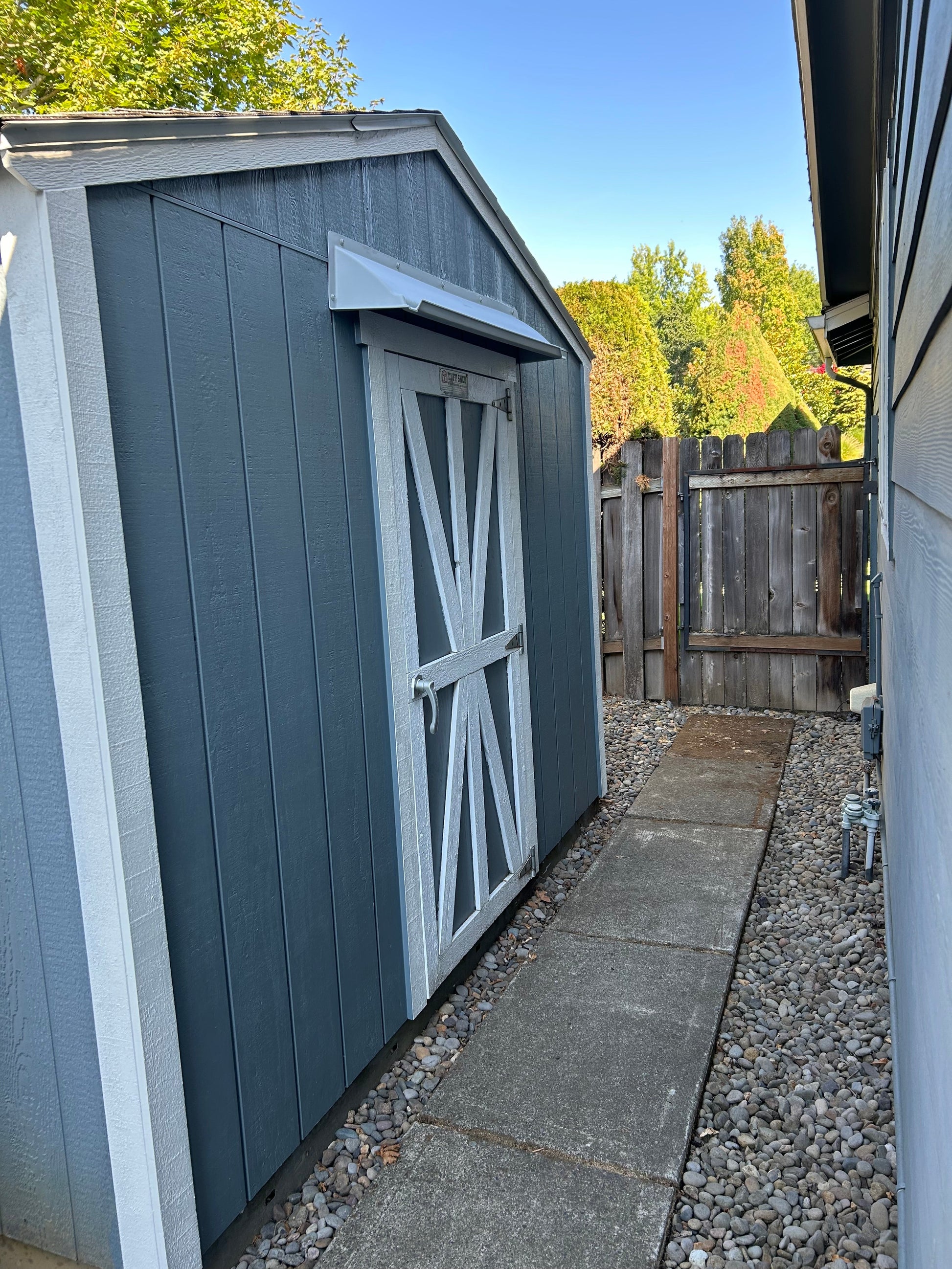 Double door leak rain guard extended width shed door rain diverter installed above doors
