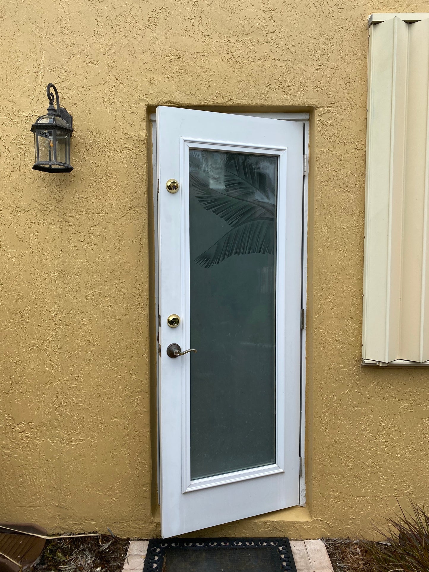 Overhead door rain guard in durable ABS plastic protecting house door from leaks and drips, 52-inch standard width door rain guard