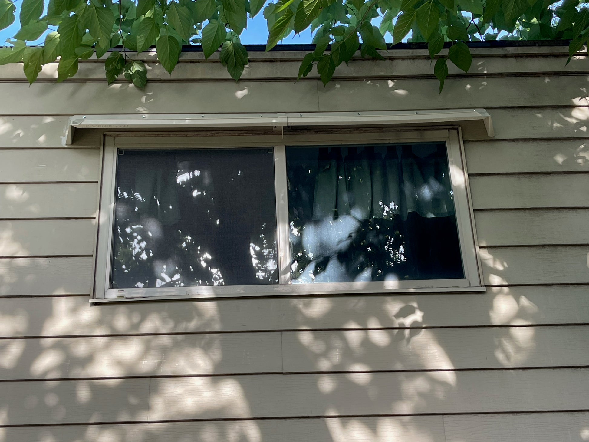 Rain guards for house on ship lap siding.