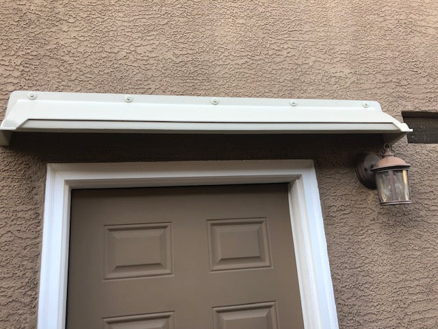 Overhead 52-inch door rain guard in almond color deflects water and prevents leaks, made from durable ABS plastic, surface-mounted with fasteners, proudly made in the USA