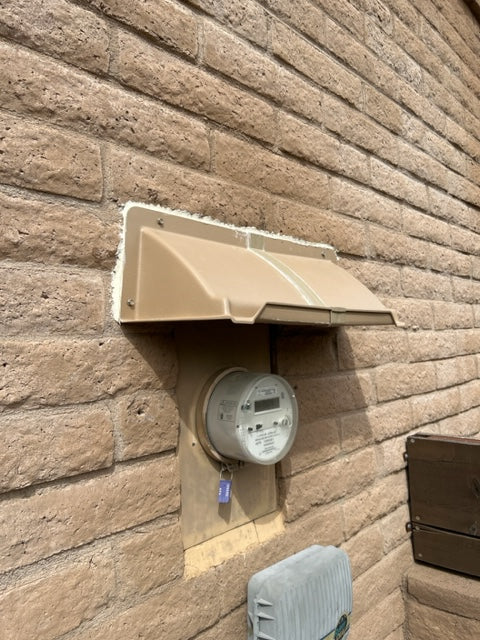 Electric Meter Rain Hoods and Shields mounted above an electric meter box.