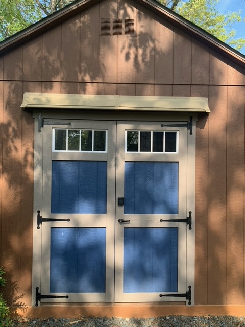 Extended width shed door rain guard preventing double door leaks and keeping storage dry