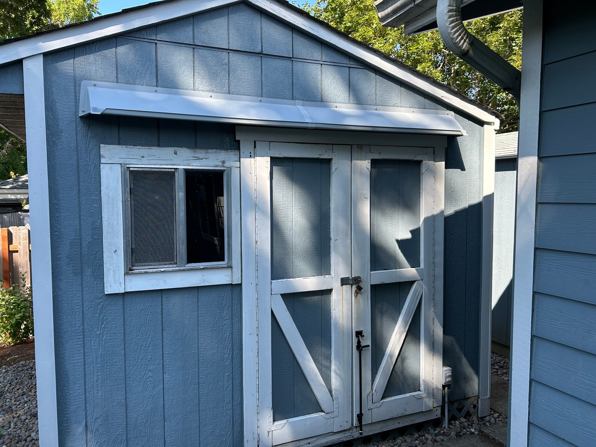 Double door leak rain guard extending 56-76 inches to prevent leaks and keep storage dry